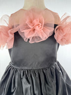 Closeup of black satin tulle girls party dress, suitable for birthdays, weddings, parties, photoshoots and special occasions