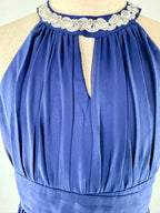 Closeup of blue halter neck chiffon girls party dress, suitable for birthdays, bridesmaids, and formal occasions