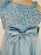 closeup of light blue tulle sequin one shoulder girls party dress, suitable for  birthdays, flower girls, photo shoots, formal occasions