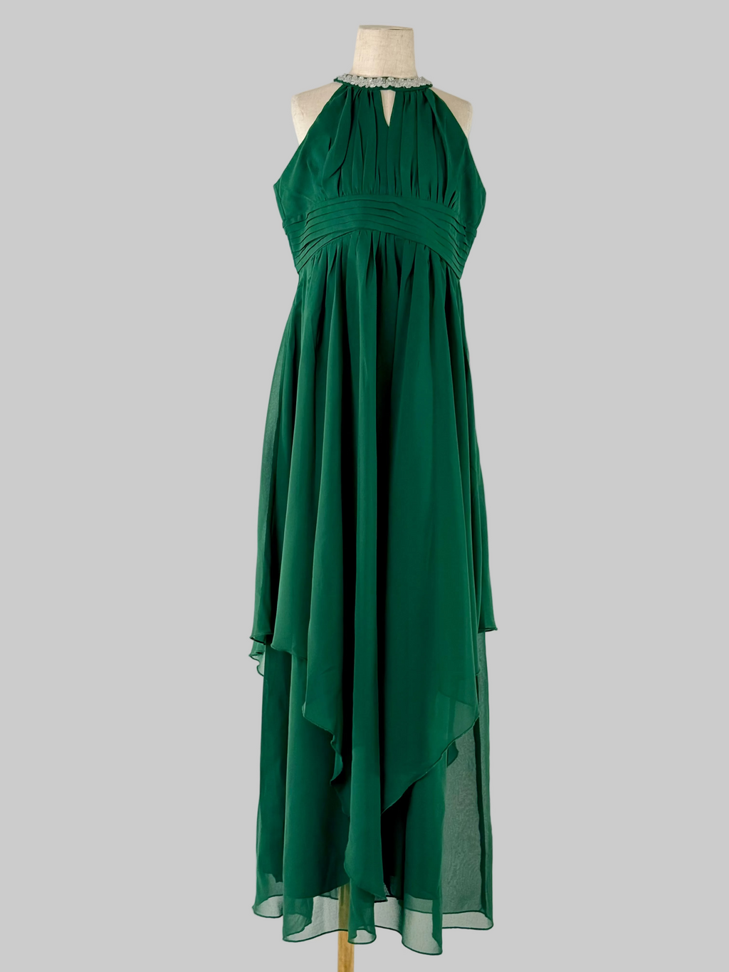 Front view of green halter neck chiffon girls party dress, suitable for birthdays, bridesmaids, and formal occasions