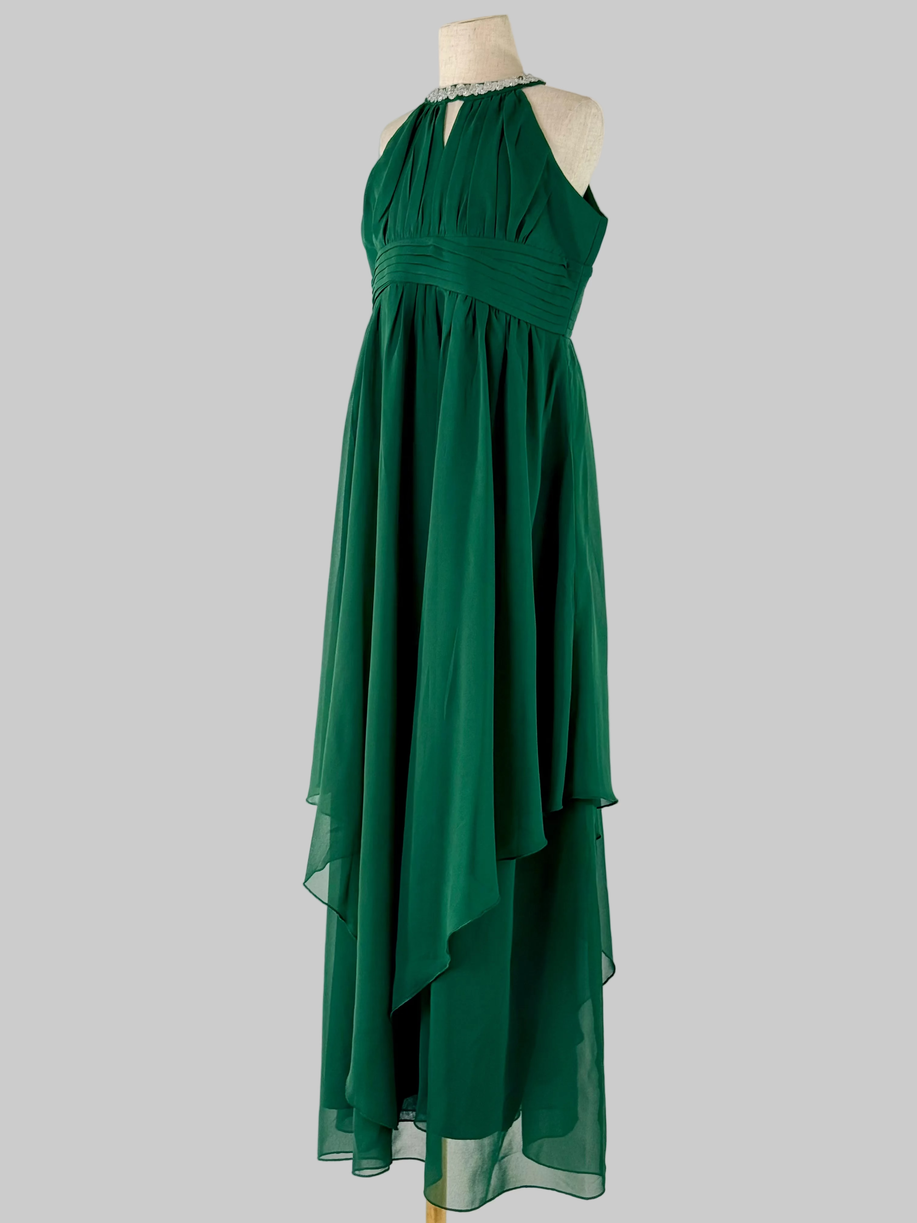 Side view of green halter neck chiffon girls party dress, suitable for birthdays, bridesmaids, and formal occasions