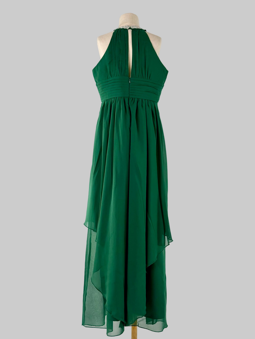 Back view of green halter neck chiffon girls party dress, suitable for birthdays, bridesmaids, and formal occasions