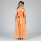 Back view of peach net tulle girls party dress, suitable for birthdays, flower girls, and formal occasions
