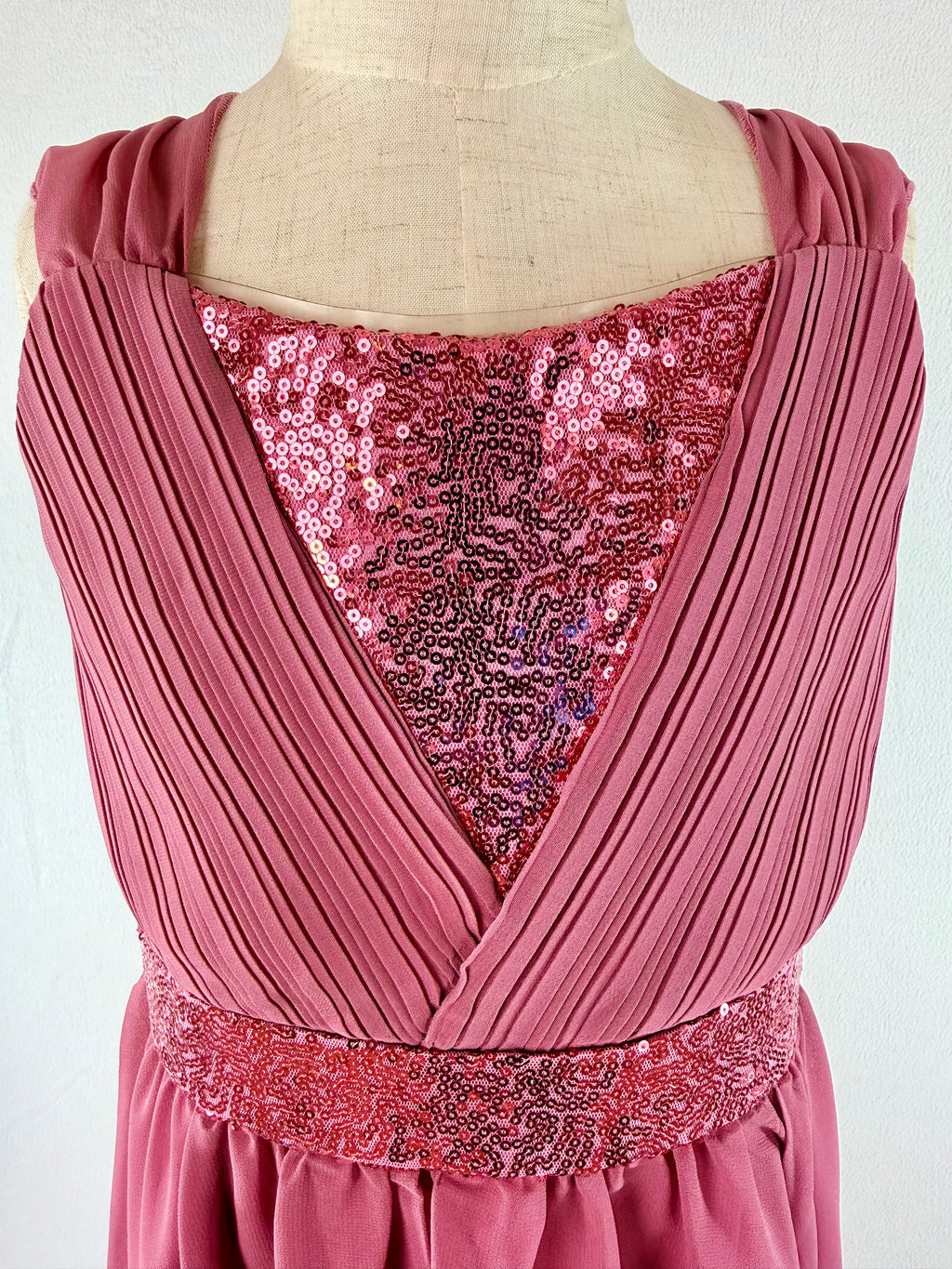 closeup of pink high-low chiffon girls party dress, suitable for birthdays, bridesmaids, and formal occasions