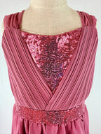 closeup of pink high-low chiffon girls party dress, suitable for birthdays, bridesmaids, and formal occasions