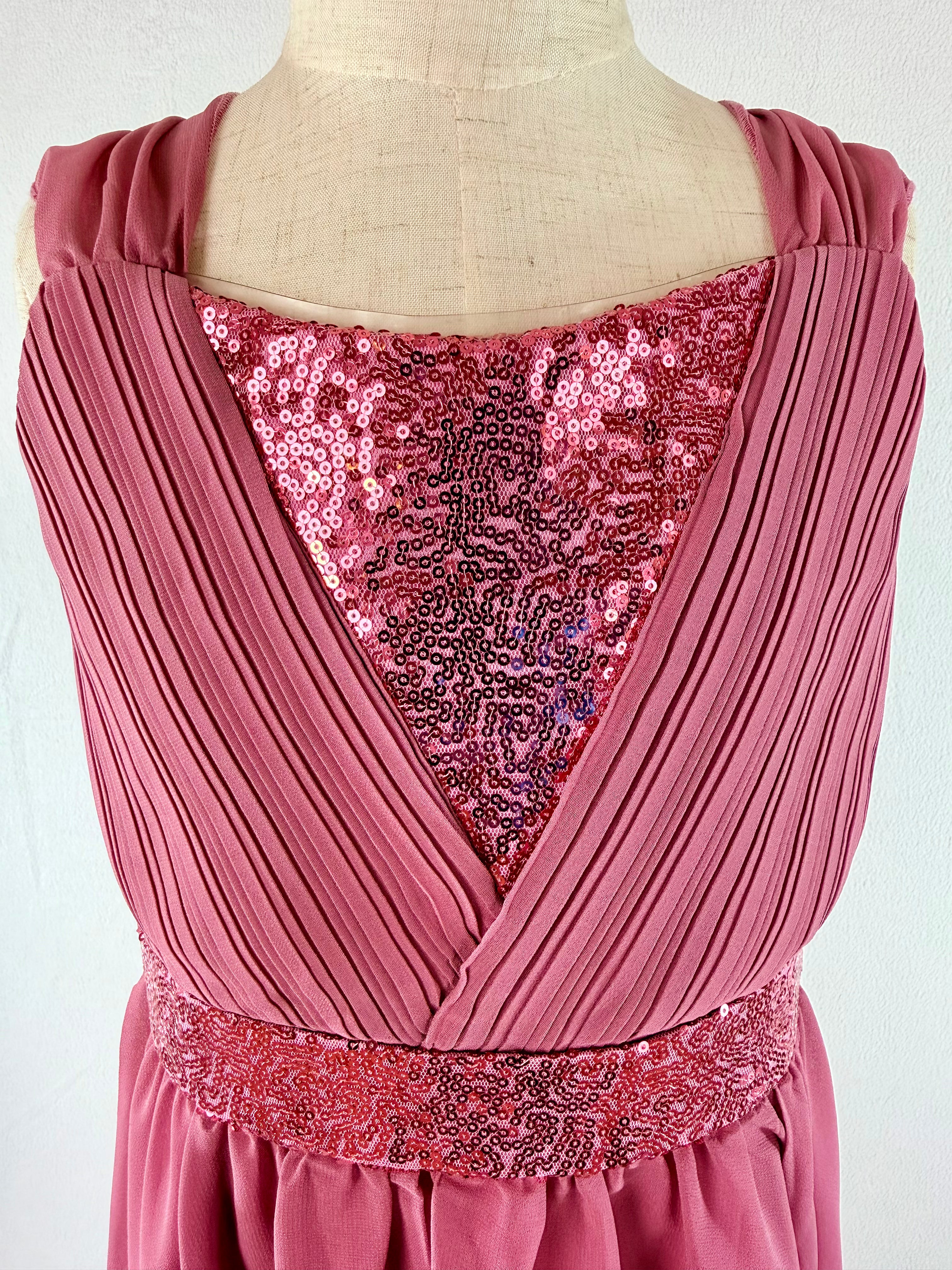 closeup of pink high-low chiffon girls party dress, suitable for birthdays, bridesmaids, and formal occasions