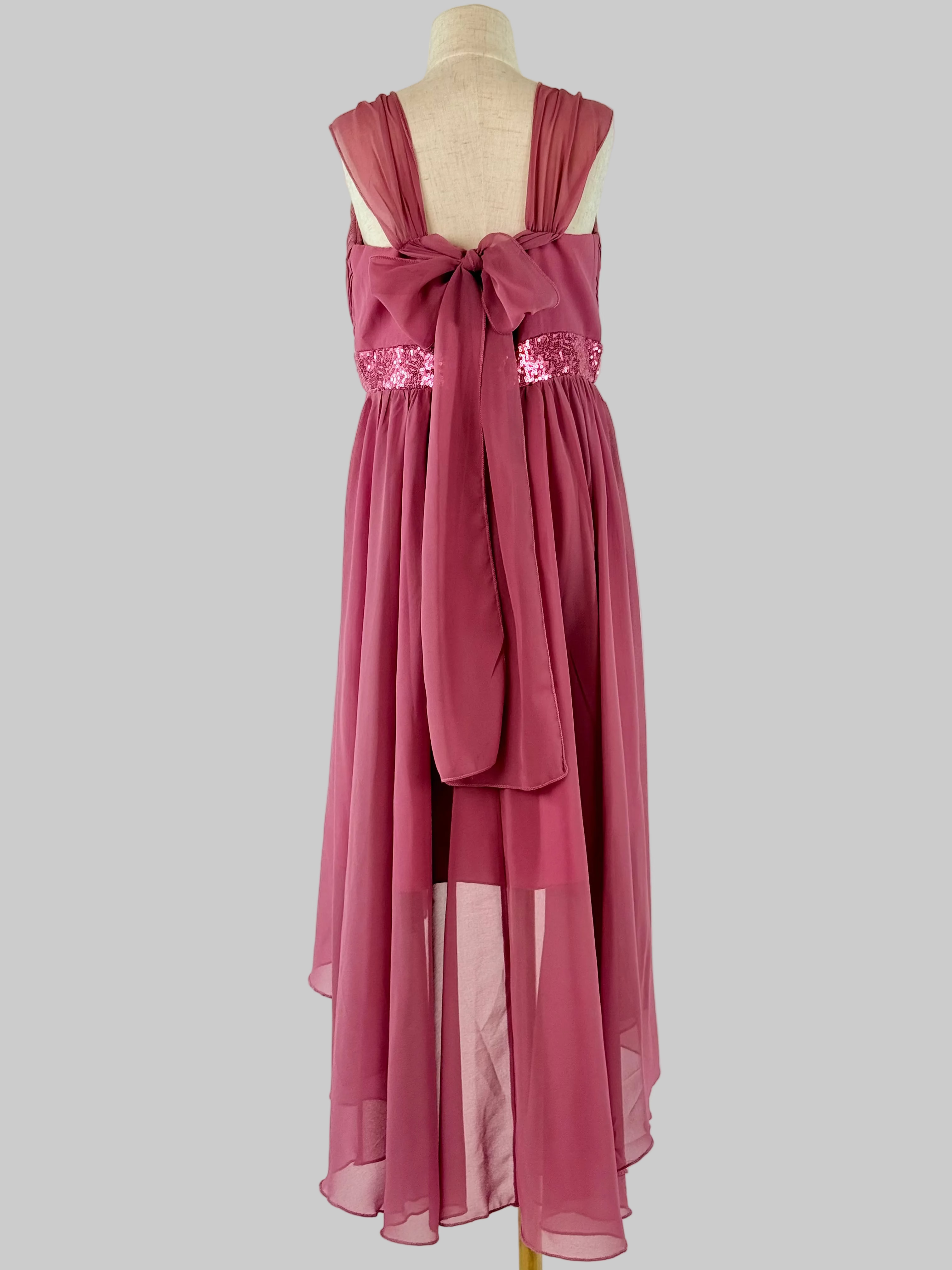 Back view of pink high-low chiffon girls party dress, suitable for birthdays, bridesmaids, and formal occasions