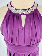 Closeup of purple halter neck chiffon girls party dress, suitable for birthdays, bridesmaids, and formal occasions