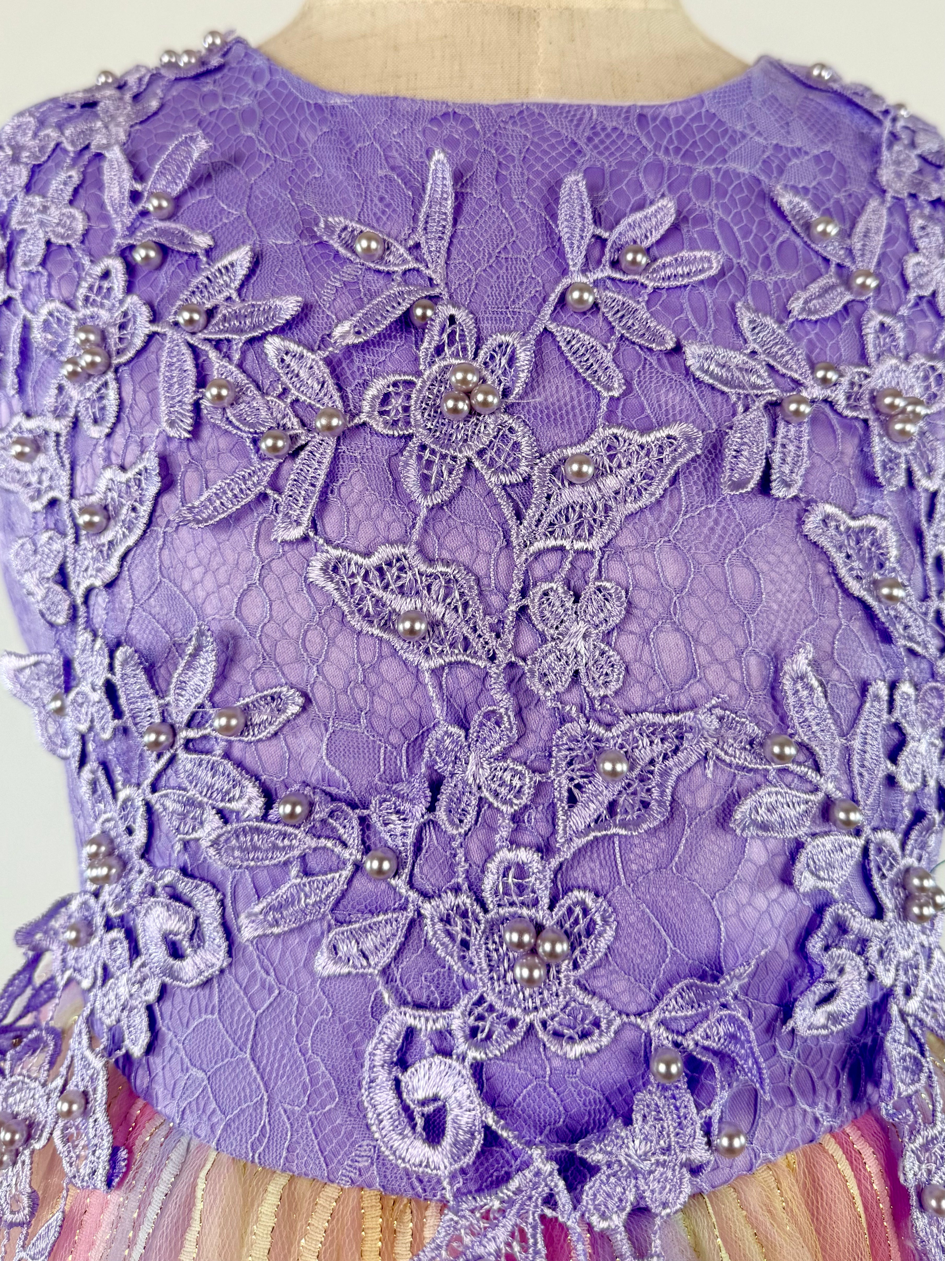 Closeup of purple tulle lace girls party dress, suitable for  birthdays, flower girls, photo shoots, formal occasions