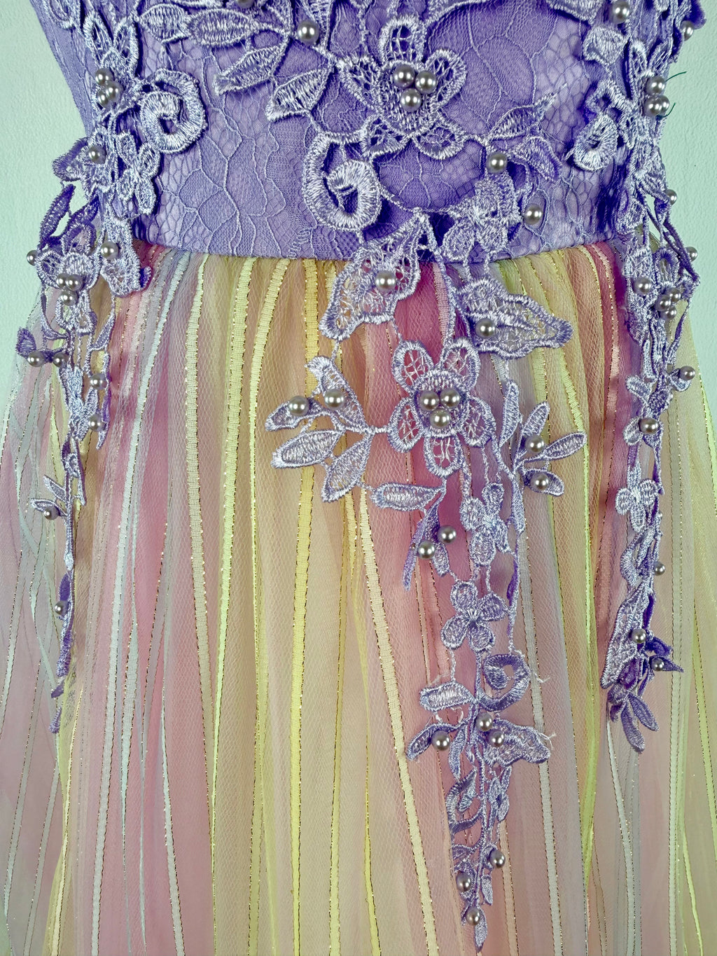 Closeup of purple tulle lace girls party dress, suitable for  birthdays, flower girls, photo shoots, formal occasions