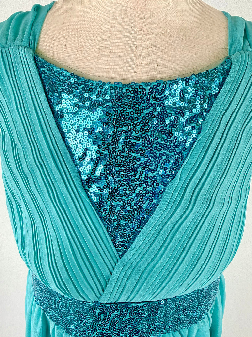 Closeup of blue high-low chiffon girls party dress, suitable for birthdays, bridesmaids, and formal occasions