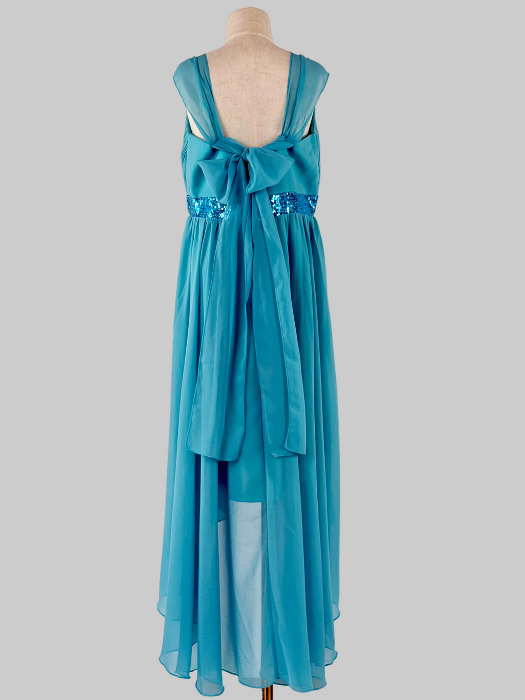 Back view of blue high-low chiffon girls party dress, suitable for birthdays, bridesmaids, and formal occasions