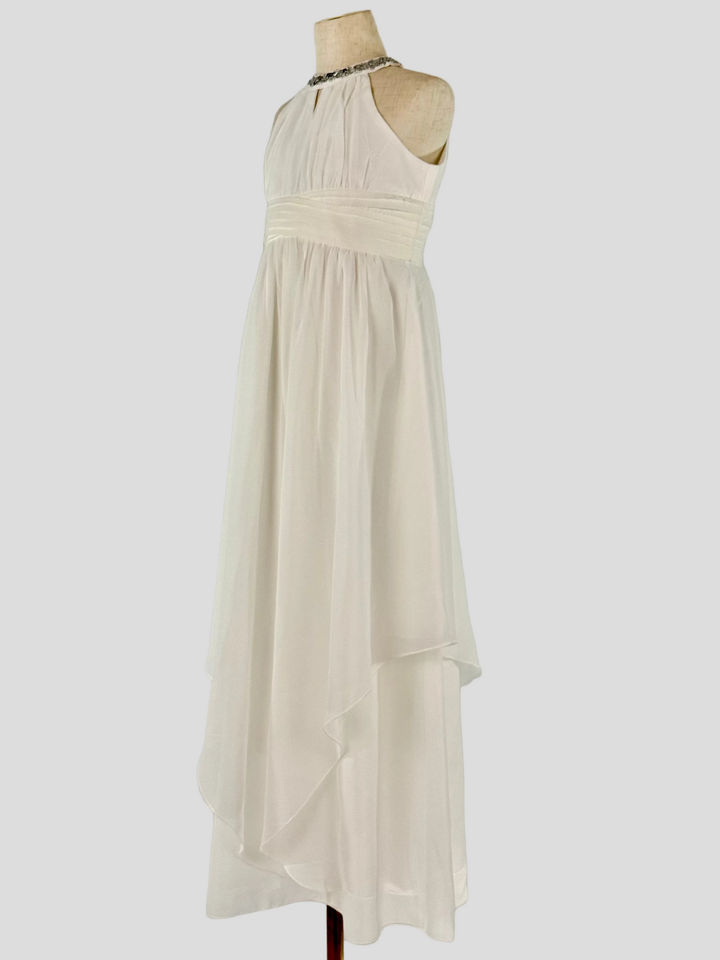 Side view of white halter neck chiffon girls party dress, suitable for birthdays, bridesmaids, and formal occasions