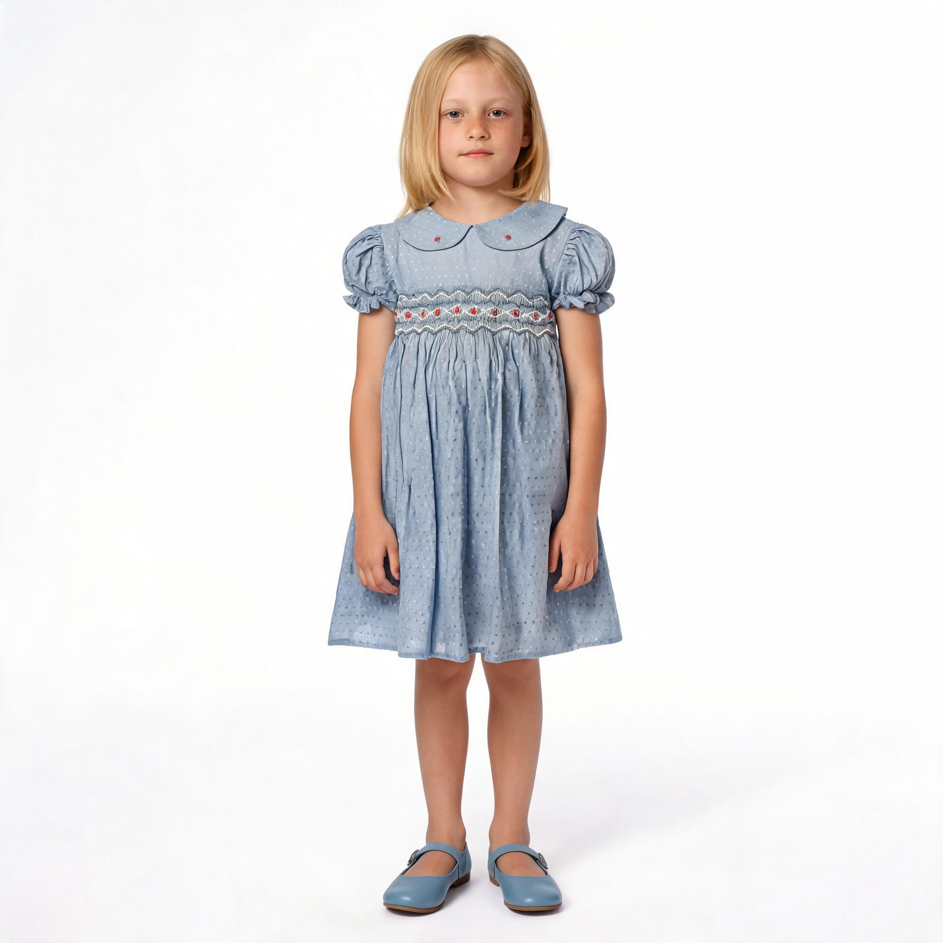 Front view of blue smocked dress. Suitable for birthdays, family gatherings, special occasions, or everyday.