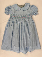 Front view of blue smocked dress. Suitable for birthdays, family gatherings, special occasions, or everyday.