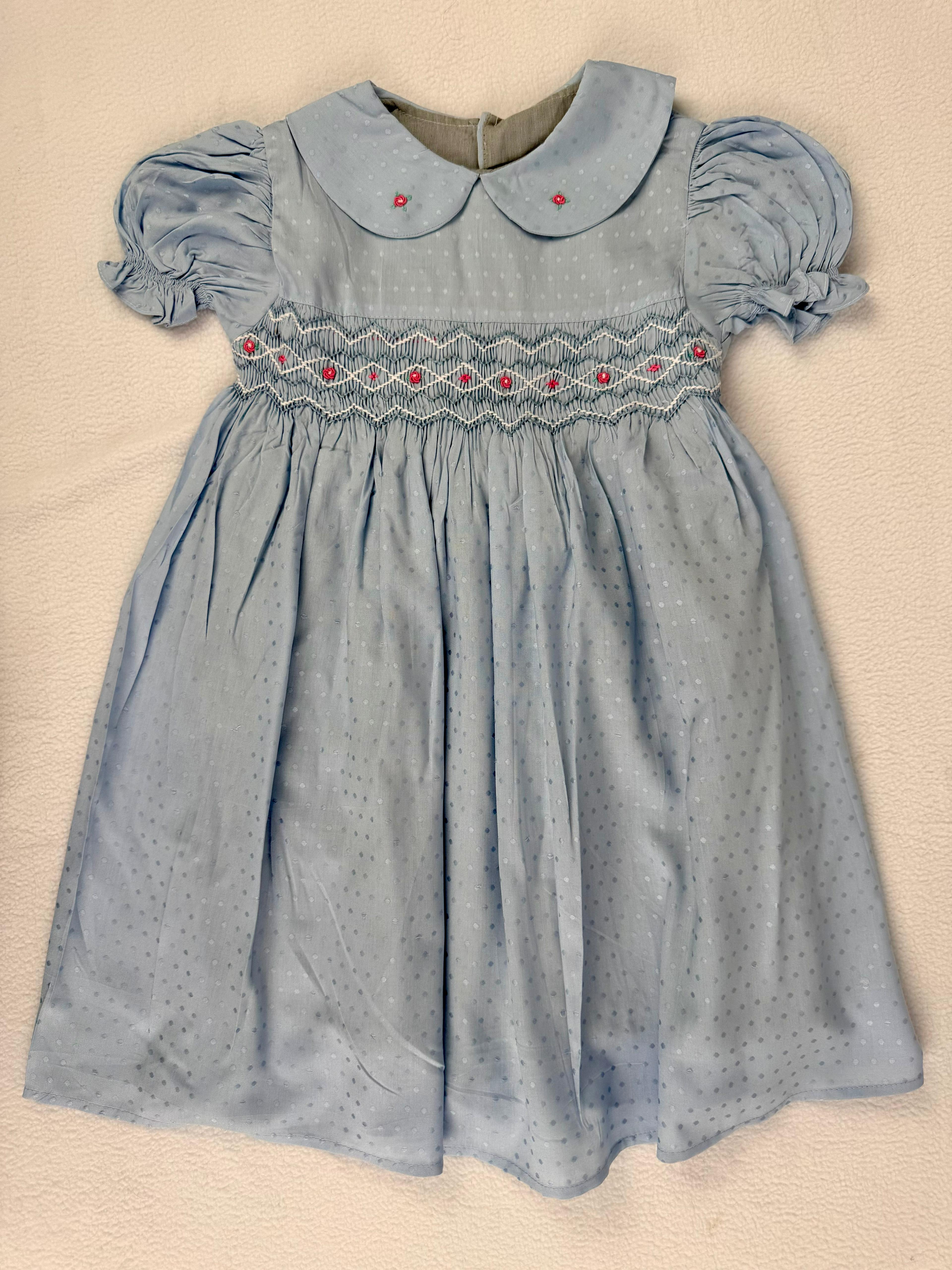 Front view of blue smocked dress. Suitable for birthdays, family gatherings, special occasions, or everyday.
