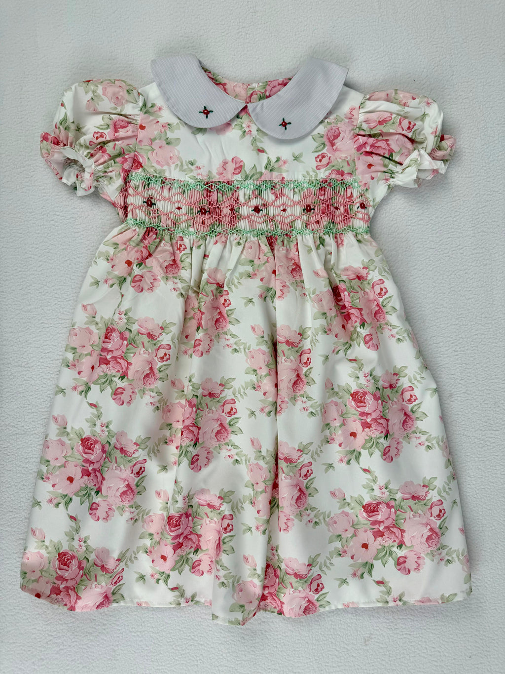 Front view of floral rose smocked dress. Suitable for birthdays, family gatherings, special occasions, or everyday.