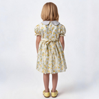 Back view of yellow floral smocked dress. Suitable for birthdays, family gatherings, special occasions, or everyday.