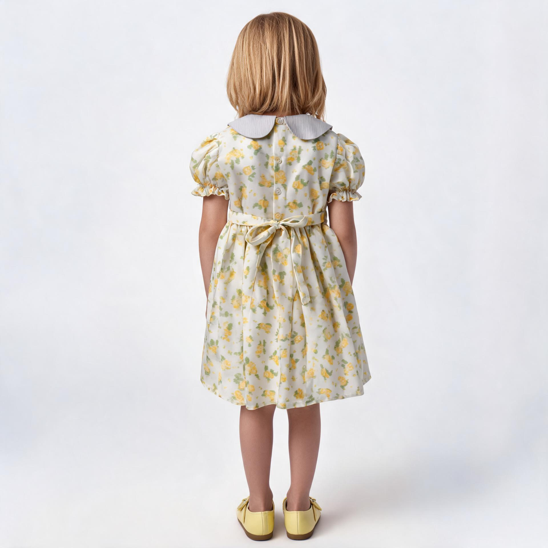 Back view of yellow floral smocked dress. Suitable for birthdays, family gatherings, special occasions, or everyday.