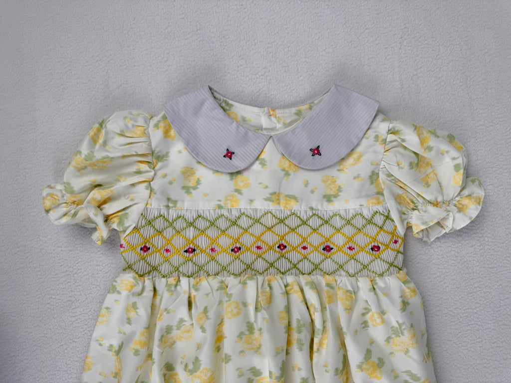 Close up of yellow floral smocked dress. Suitable for birthdays, family gatherings, special occasions, or everyday.