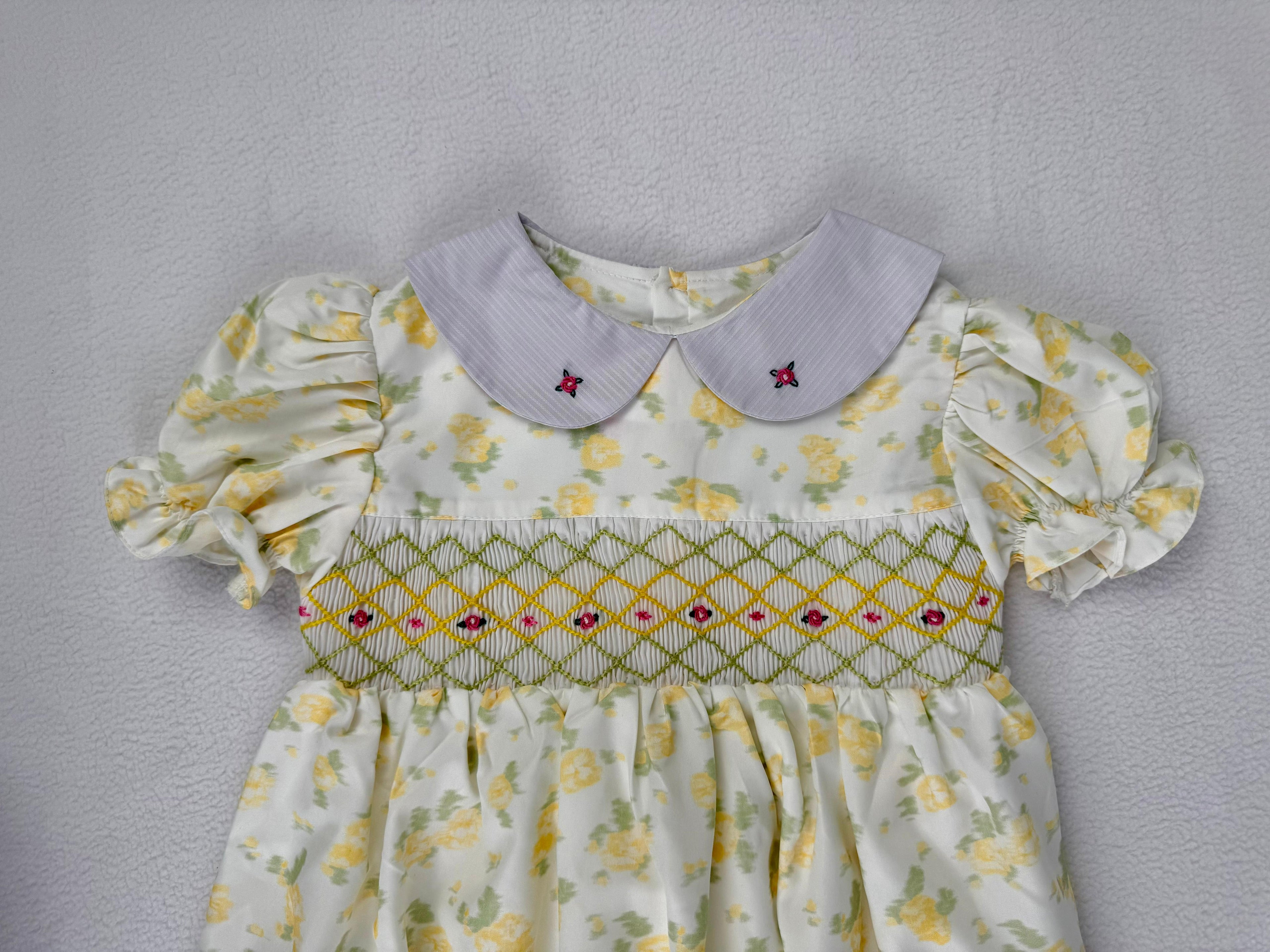 Close up of yellow floral smocked dress. Suitable for birthdays, family gatherings, special occasions, or everyday.