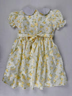 Back view of yellow floral smocked dress. Suitable for birthdays, family gatherings, special occasions, or everyday.
