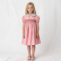 Front view of pink smocked dress. Suitable for birthdays, family gatherings, special occasions, or everyday.