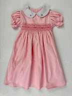 Front view of pink smocked dress. Suitable for birthdays, family gatherings, special occasions, or everyday.