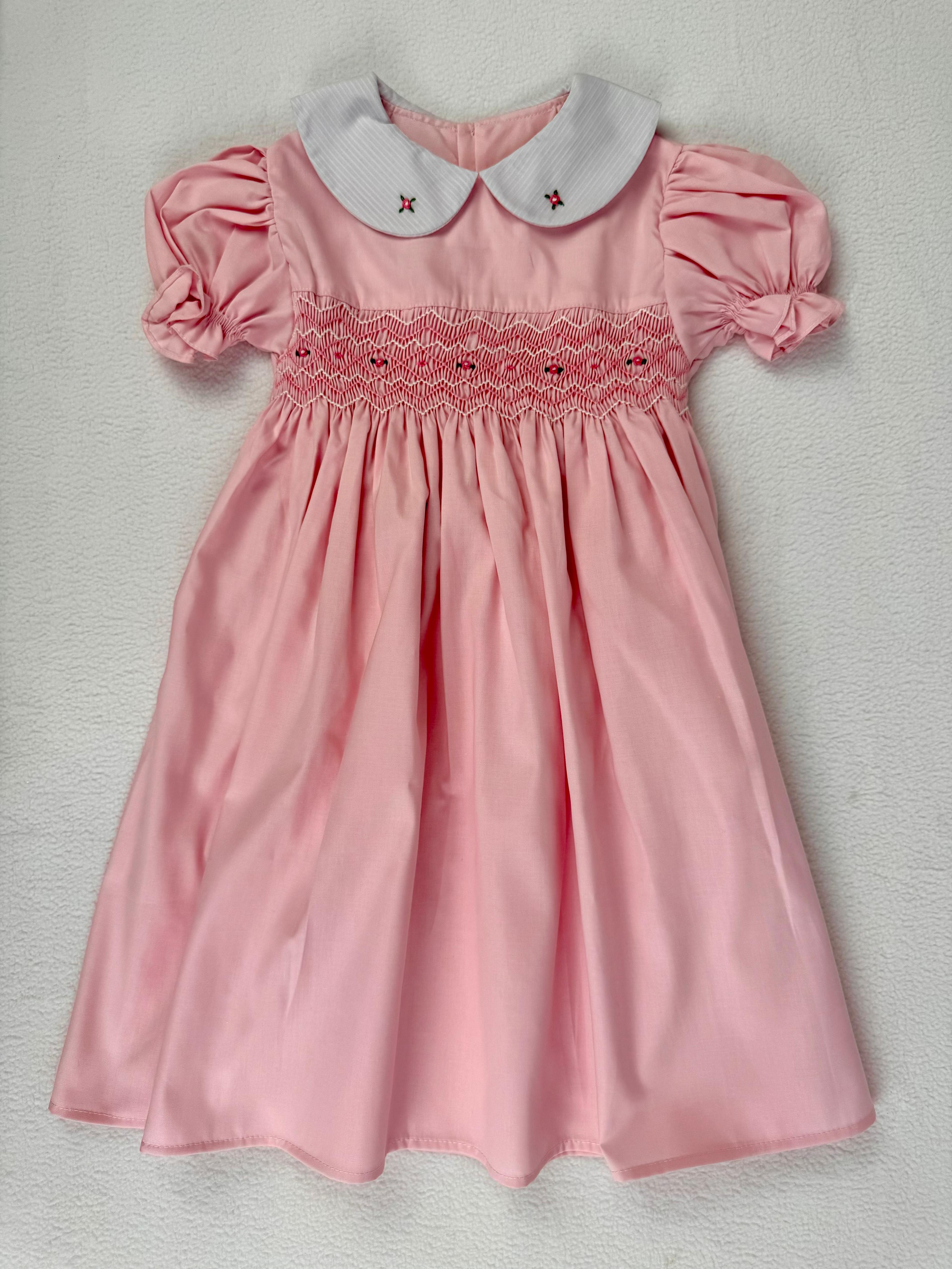 Front view of pink smocked dress. Suitable for birthdays, family gatherings, special occasions, or everyday.
